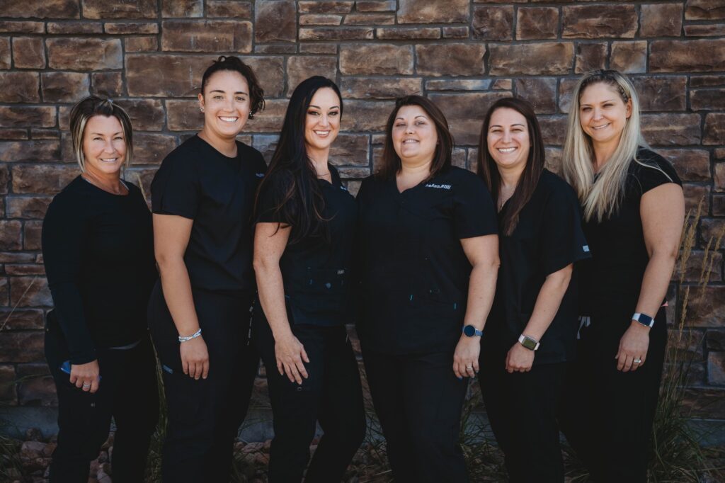 The group of women's staffs in twin aspen dental center at Parker, CO