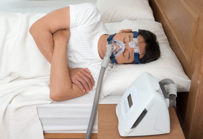 A person is sleeping peacefully after getting sleep apnea treatment in Parker, CO